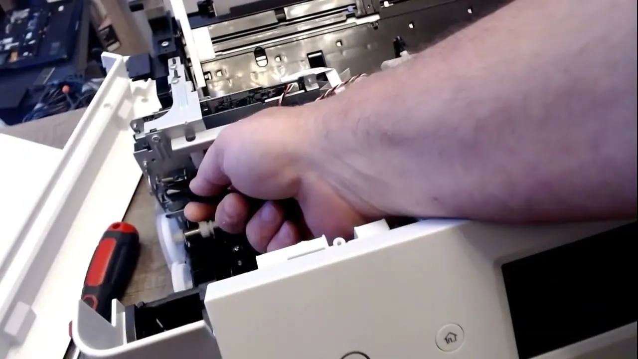 An amber status light glows on the control panel of an Epson printer.