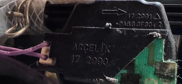 Cleaning the rubber door seal of a dishwasher to fix latch issues.