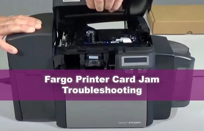 Cleaning supplies arranged next to a Fargo DTC1250e printer to prevent future device errors.
