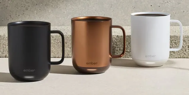 Close up of a smart mug base showing residue on the gold charging rings.