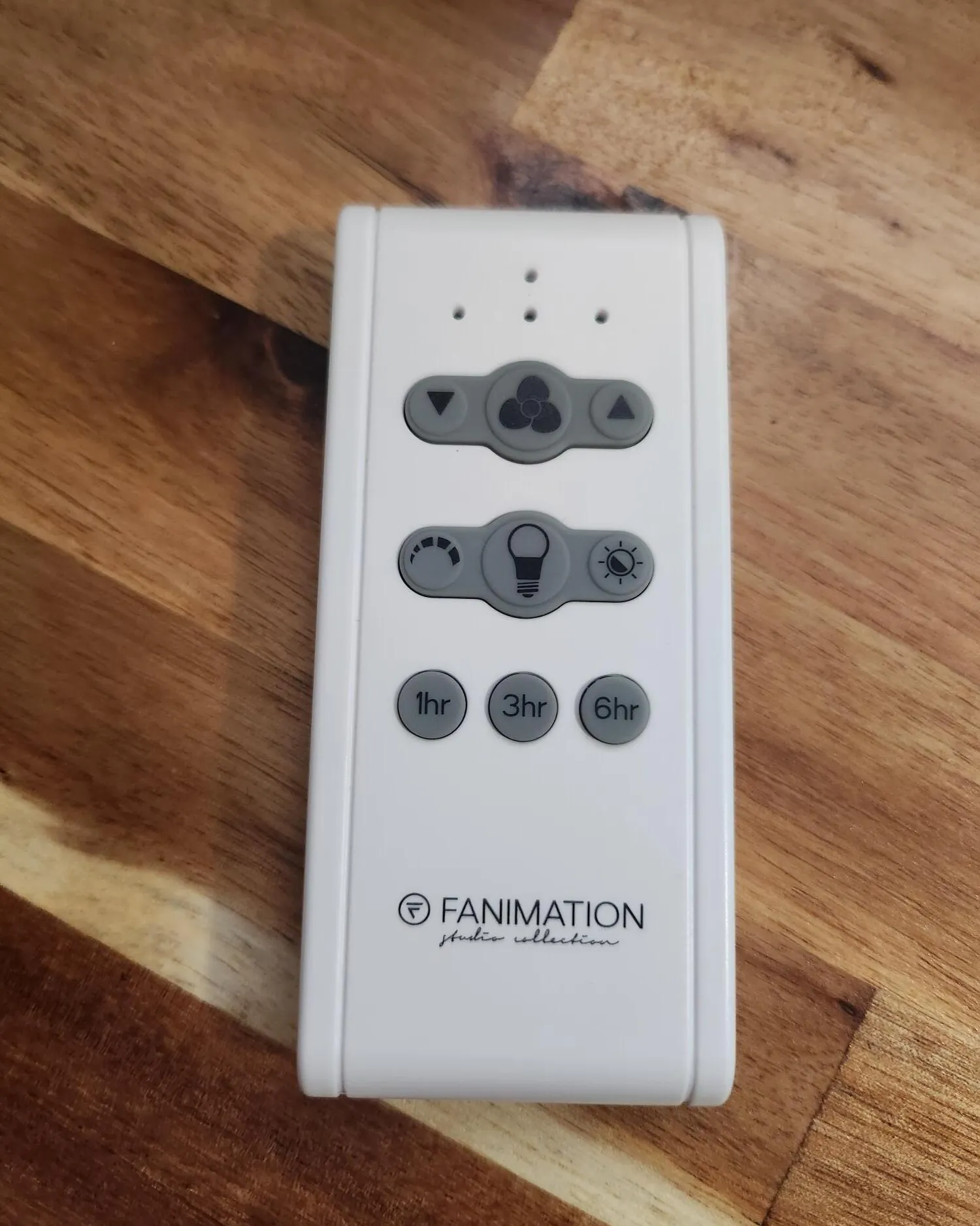 A fresh battery is inserted into a remote to prevent fanimation remote failures.