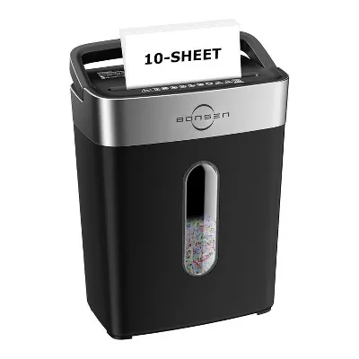 Hands carefully feed a small stack of paper into a clean office paper shredder.