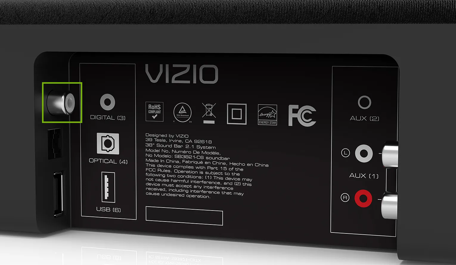 Hands plugging an HDMI cable into the back of an energy soundbar.