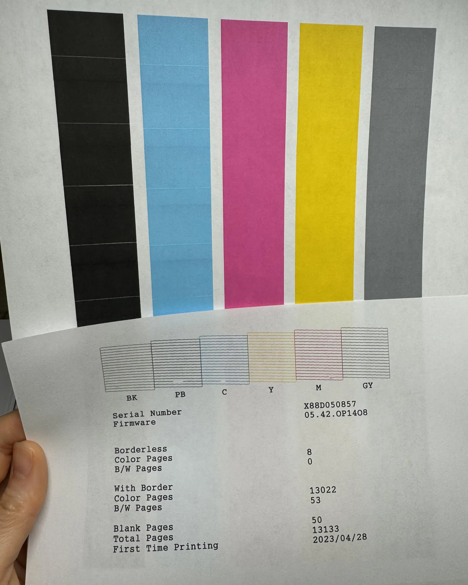 Inspecting the internal carriage and pulley system of an Epson ET-8550 printer.