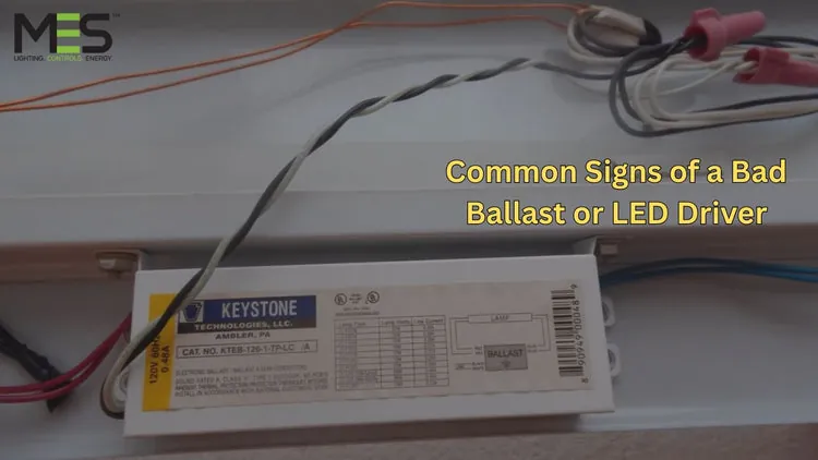 Inspecting internal wiring and battery connections to troubleshoot emergency light flickering issues.