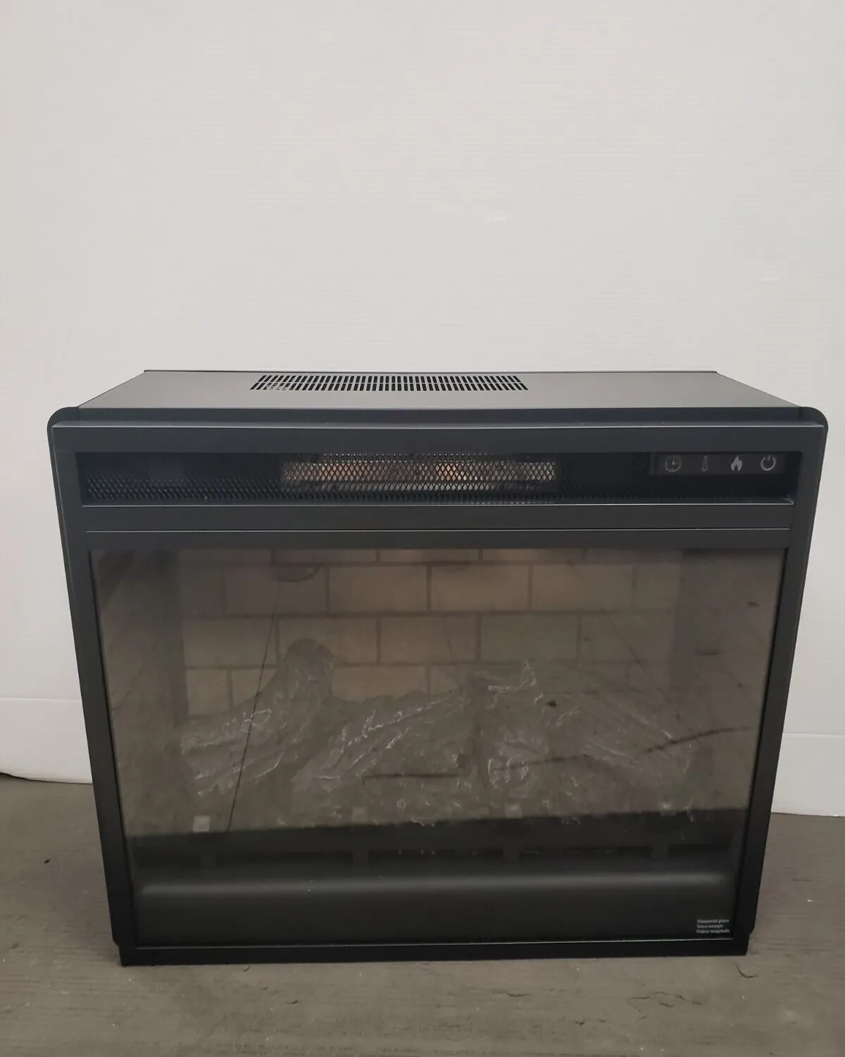 Internal electronic components and safety sensors of an electric fireplace unit.