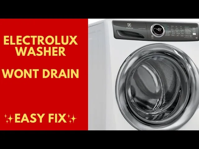 A person carefully unscrewing the drain pump filter on an Electrolux washing machine.