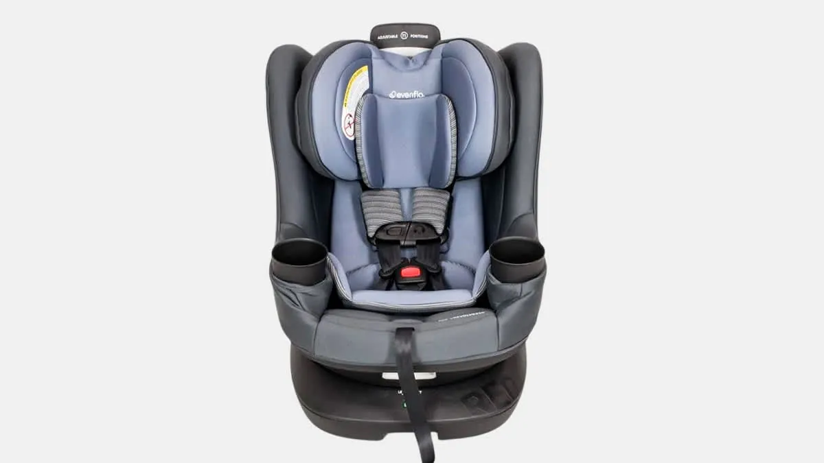 Using a vacuum to remove debris from the car seat rotation mechanism.