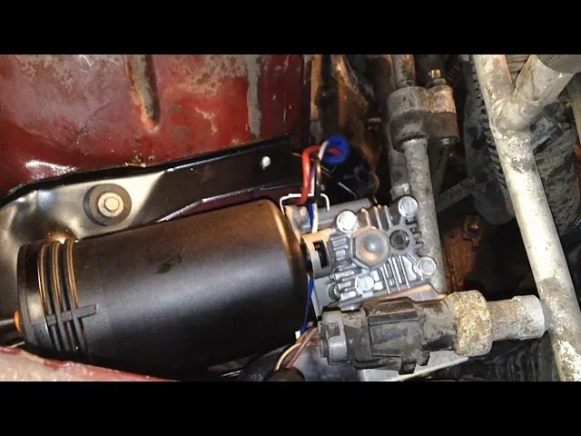 Checking the fuse panel to troubleshoot Ford Expedition air suspension issues inside the cabin.