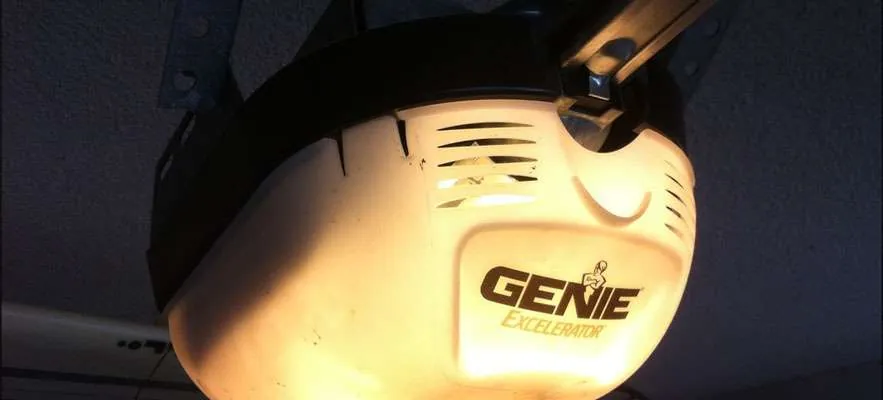 Cleaning the safety sensor lens to ensure proper garage door operation.