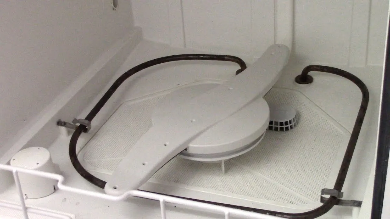 Close up of a dishwasher door latch mechanism showing the safety sensor components.