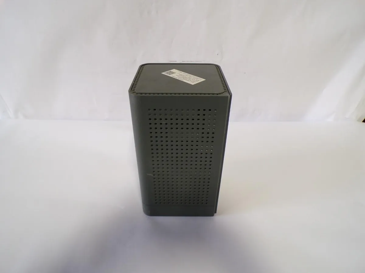 A GigaSpire GS4220e gateway router positioned correctly on an open shelf for optimal signal.
