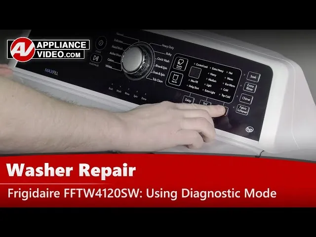 Internal pressure sensing tube and hoses inside a Frigidaire washing machine during maintenance.