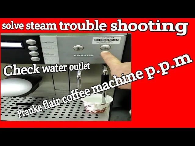 Internal view of a coffee machine being inspected for routine maintenance.