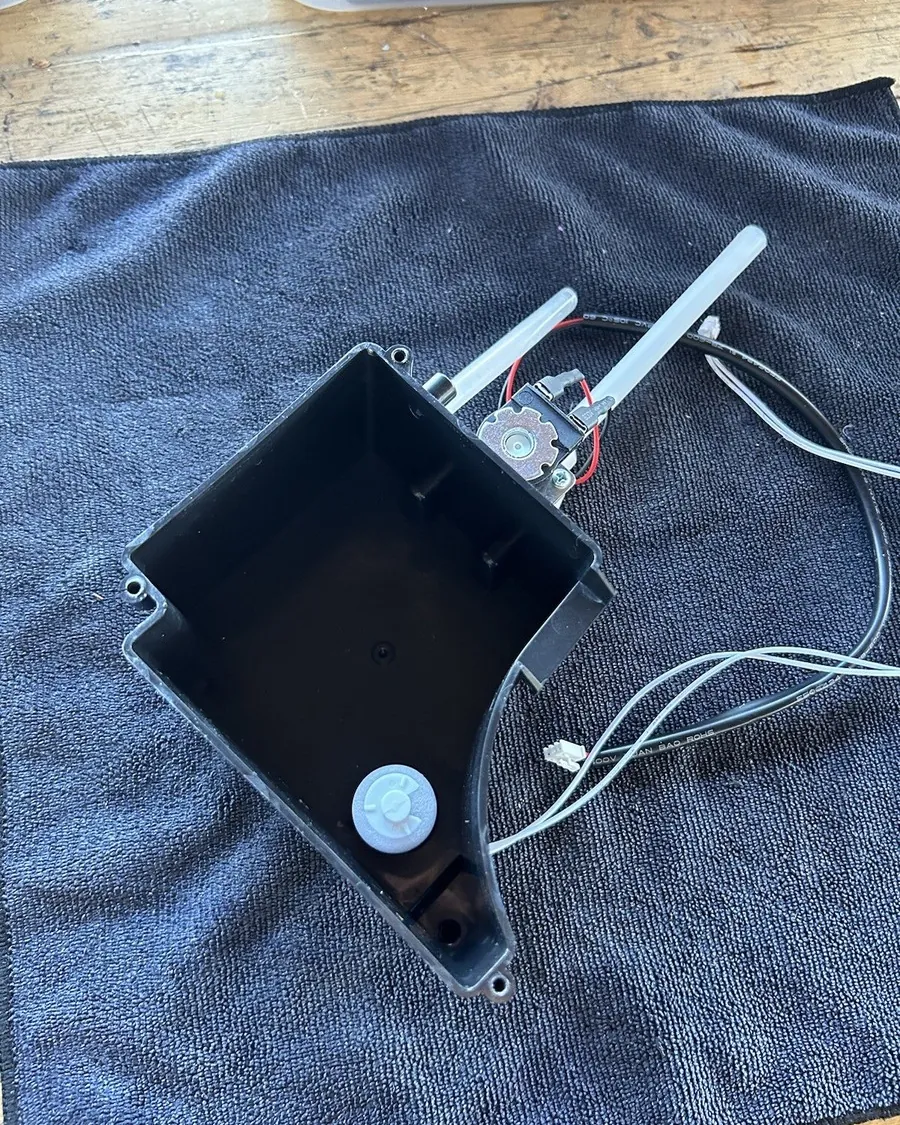 Proper maintenance and water refilling for a Frigidaire portable ice maker.