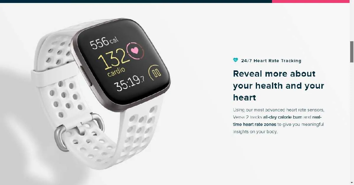 A smartwatch with a blank screen rests near a charging cable.